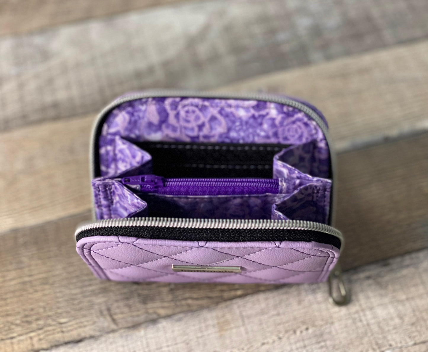 Quilted lilac zip around wallet. lining view