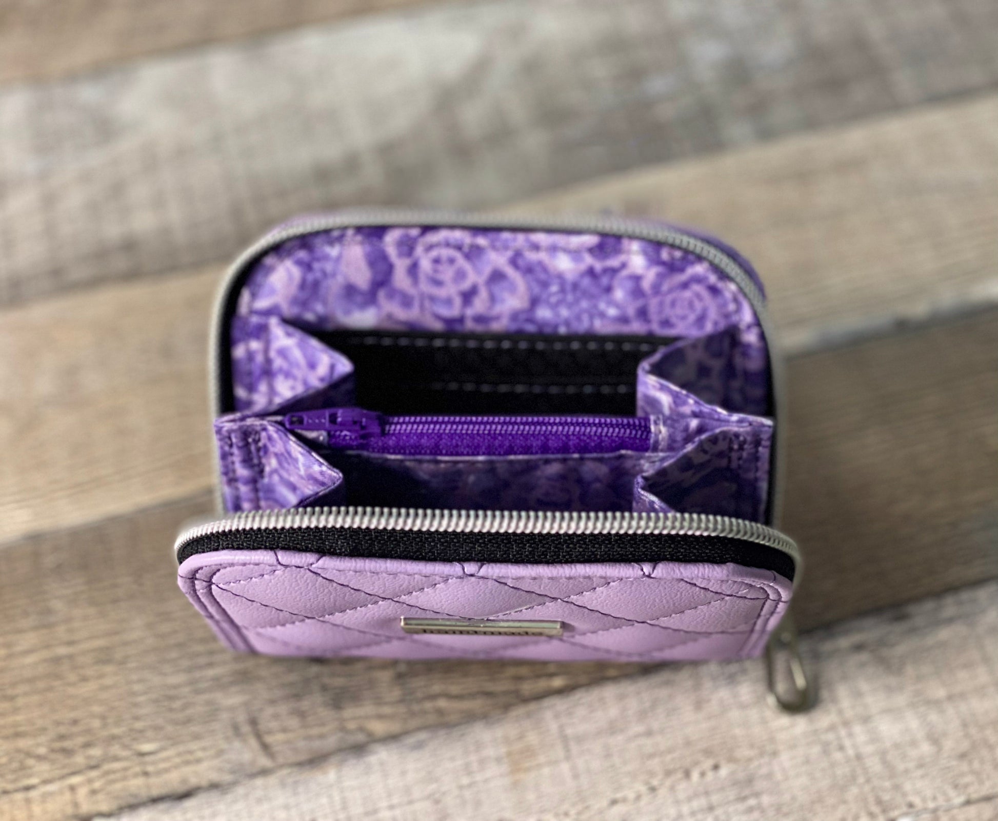 Quilted lilac zip around wallet. lining view