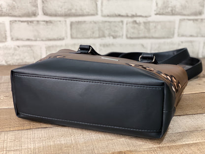 Brown faux leather handbag with the bottom view. Embroidered leopard print accents on the front and back panels. 