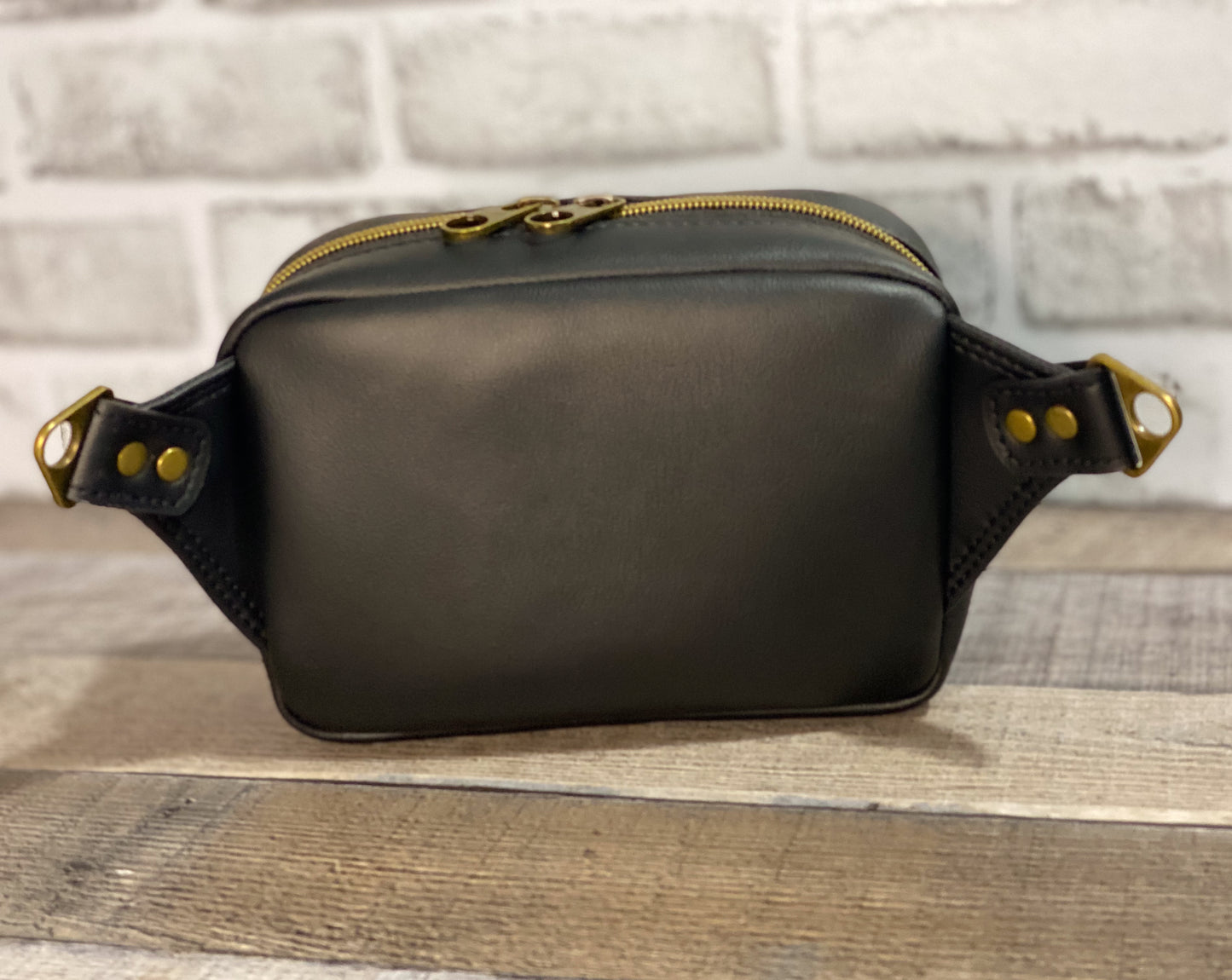 Back view of faux leather hip bag. 
