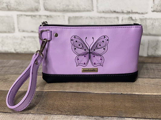 Lilac wristlet with embroidered butterfly front panel