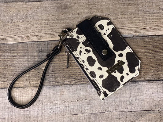 Black and white cow print purse pal wristlet wallet front panel view. 