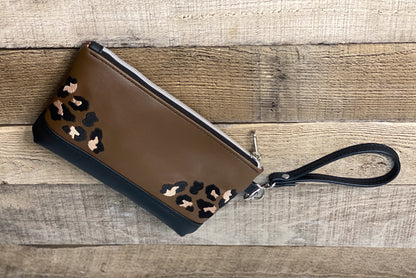 Brown wristlet with leopard print accents. Back View. 
