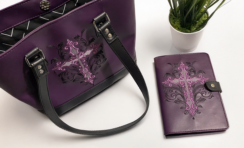 Large plum faux leather tote with matching notebook cover.  Embroidered cross on the front. 